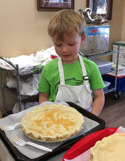 Creative Kids Fort Mill | child baking apple pie