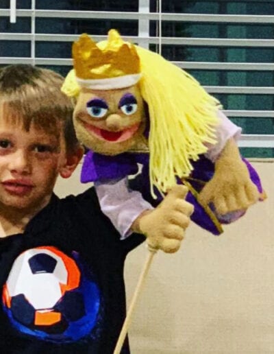 Creative Kids Fort Mill | little boy playing with a puppet