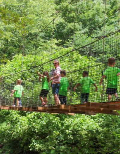 Creative Kids Fort Mill | children at camp walking on bridge